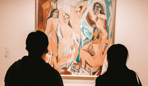poeple in museum looking at a Picaso painting peach blue tan